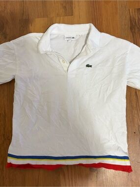 Lacoste Boys size 8 White Polo Shirt with Multicolor Hem, relaxed fit